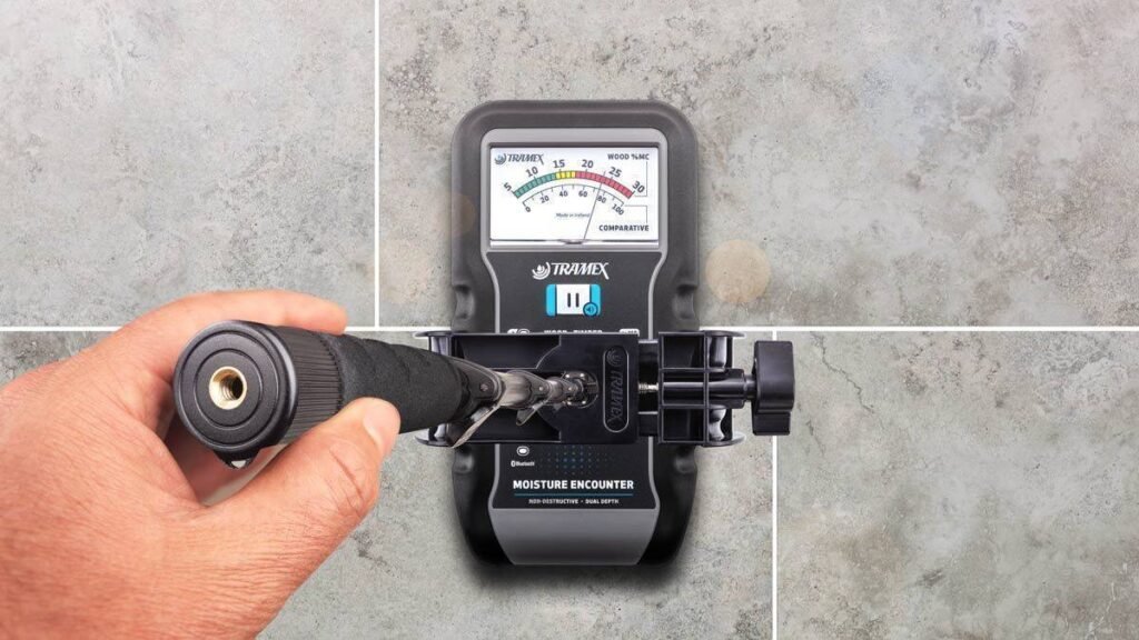 Protimeter moisture meter being used to evaluate elevated moisture levels within a water-stained interior wall following a leak or water intrusion event.
